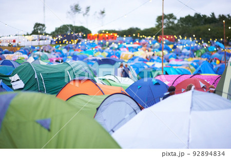 Tent city. Shot of a campsite filled with many colorful tents at an outdoor festival. Tent city. Shot of a campsite filled with many colorful tents at an outdoor festival. 92894834