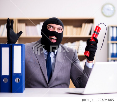 Criminal businessman with dynamite in the office 92894865