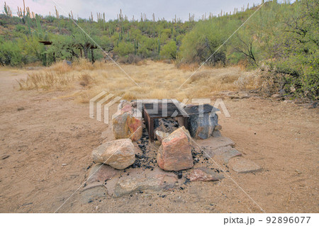 Natural rock fire pit with box grills in the middle at Tucson, Arizona 92896077