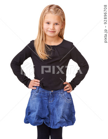 Shes a little model. A cute young girl posing against a white background. 92896708