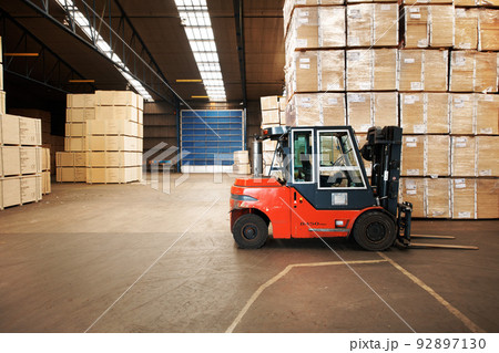 Our service is shipping good. A large warehouse storing big wooden boxes with a forklift. Our service is shipping good. A large warehouse storing big wooden boxes with a forklift. 92897130