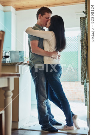 We fall deeper in love each day. Shot of a loving young couple embracing each other. 92898124