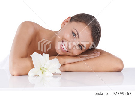 Her radiant beauty is the product of great skincare. Cropped shot of a beautiful young woman isolated on white. 92899568