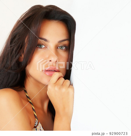 Seductive look. Closeup portrait of a woman wering a bikini leaning against wall. Seductive look. Closeup portrait of a woman wering a bikini leaning against wall. 92900723