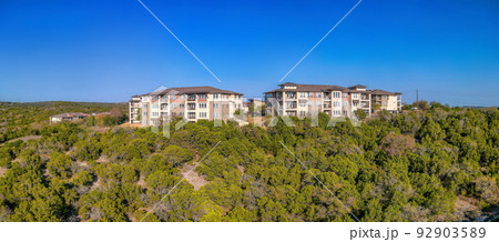 Austin, Texas- Complex apartment buildings near the cliff in a panoramic view 92903589