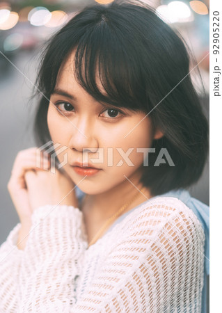 Portrait of young adult asian woman with 80s style japanese fashion at city outdoor Portrait of young adult asian woman with 80s style japanese fashion at city outdoor 92905220