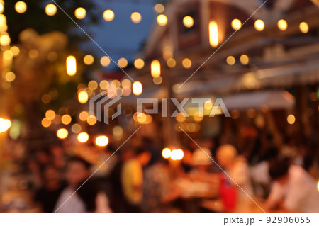 blurred image at the restaurant night time, many people in the restaurant eat and party happy relaxing 92906055