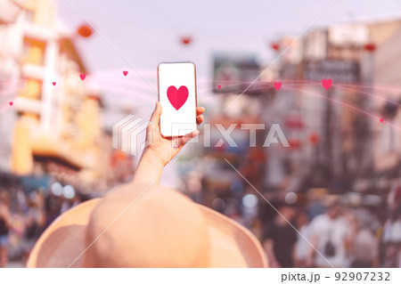 Woman hand using mobile phone for dating online Woman hand using mobile phone for dating online 92907232