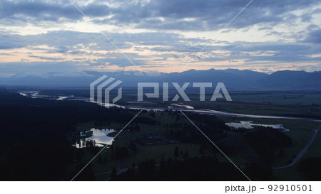 Aerial of valley in Altai and country houses under sunset sky 92910501