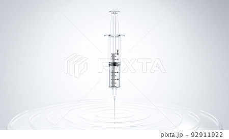 Syringe in center of target dartboard. Bright light from behind. 92911922