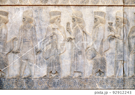 Ancient wall with bas-relief with assyrian foreign ambassadors with gifts and donations, Persepolis, Iran Ancient wall with bas-relief with assyrian foreign ambassadors with gifts and donations, Persepolis, Iran 92912243