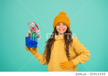 Shop for kids. Happy 2020 year. Gift for good luck. Successful rat year. Appease with gift. Shopping tips. Happy girl hold mouse toy and wrapped gift box. Kid knitted sweater and hat play plush toy Shop for kids. Happy 2020 year. Gift for good luck. Successful rat year. Appease with gift. Shopping tips. Happy girl hold mouse toy and wrapped gift box. Kid knitted sweater and hat play plush toy 92913439