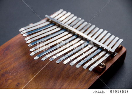 Traditional wooden kalimba isolated on black Traditional wooden kalimba isolated on black 92913613