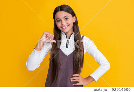 glad child with long hair on yellow background glad child with long hair on yellow background 92914600