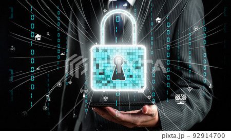 Businessman show hologram of cyber security management allusive technology Businessman show hologram of cyber security management allusive technology 92914700