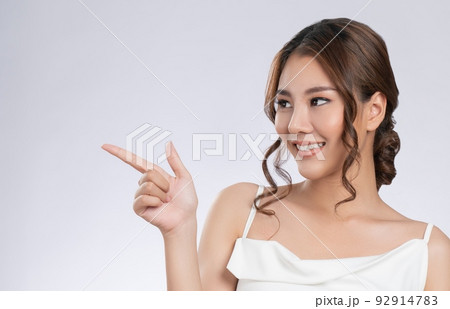 Gorgeous woman with healthy skin in a concept of empty space for beauty product. Gorgeous woman with healthy skin in a concept of empty space for beauty product. 92914783