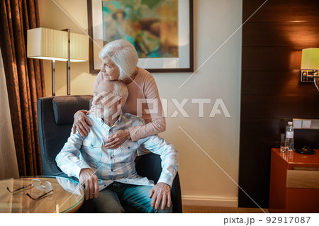 Elderly couple in a nice room looking happy and peaceful 92917087