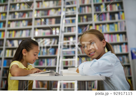 Two teenage girls in the reading room Two teenage girls in the reading room 92917115