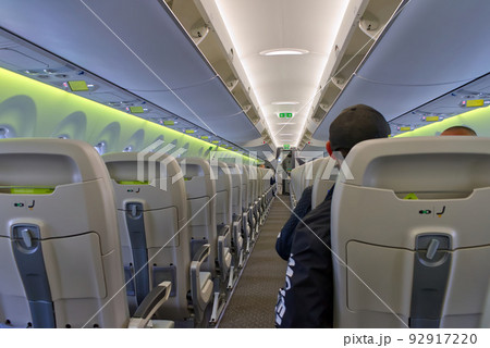 Passengers traveling by plane, inside of an airplane 92917220