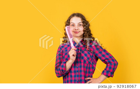 happy girl with hair brush. healthy and strong hair. hairdresser beauty salon. kid brushing curls. Strong and healthy hair concept. Small child long hair. fashion accessory tool 92918067