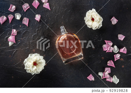 Rose fragrance bottle, a luxury product, shot from the top on black Rose fragrance bottle, a luxury product, shot from the top on black 92919828