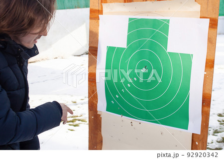 Getting into the top ten hit the target. Tyre, paper target, gun shots. winter 92920342