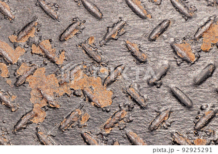 Black color non-slip metal with red rust textured background 92925291