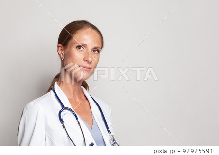 Medical physician doctor woman over white background, closeup portrait Medical physician doctor woman over white background, closeup portrait 92925591