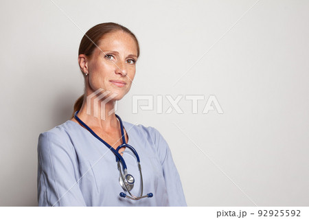 Friendly positive doctor woman looking at camera, closeup portrait 92925592
