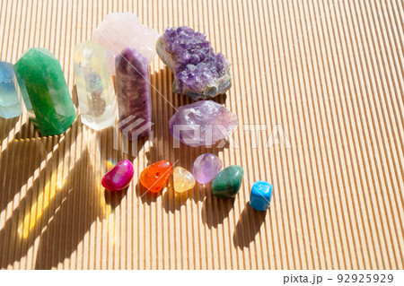 Healing crystals on brown background 92925929