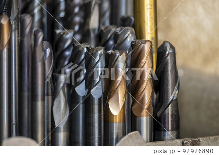 Close-up scene the group of used cutting tools for CNC milling machine. Close-up scene the group of used cutting tools for CNC milling machine. 92926890