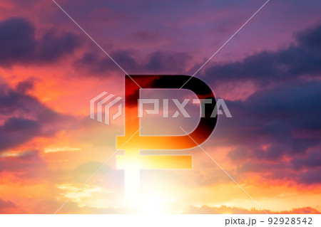 The symbol of the Russian ruble against the background of a beautiful sunset or sunrise in the sky. Double exposure. The concept of investment, banking and the crisis The symbol of the Russian ruble against the background of a beautiful sunset or sunrise in the sky. Double exposure. The concept of investment, banking and the crisis 92928542