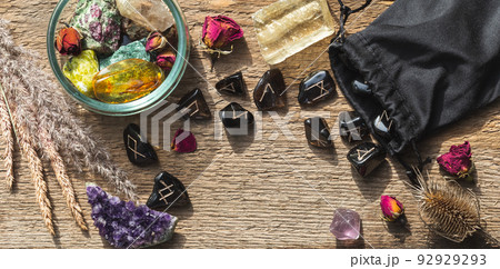 Natural minerals and rune stones set up on wood Natural minerals and rune stones set up on wood 92929293