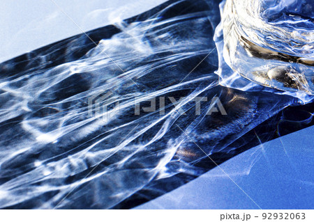 Beautiful caustic effect as light passes through a glass. Restaurant and beverage advertising backdrop Beautiful caustic effect as light passes through a glass. Restaurant and beverage advertising backdrop 92932063