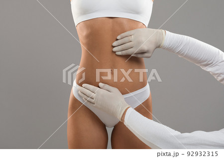 Body Sculpting Concept. Unrecognizable Young Female Getting Consultation At Plastic Surgery Clinic Body Sculpting Concept. Unrecognizable Young Female Getting Consultation At Plastic Surgery Clinic 92932315