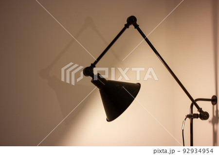 Bedside lamp in room Stylish modern home interior light fixture illuminates flat 92934954