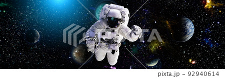 Picture of astronaut spacewalking with glowing stars . Astronaut in outer space. Elements of this image furnished by NASA. Picture of astronaut spacewalking with glowing stars . Astronaut in outer space. Elements of this image furnished by NASA. 92940614