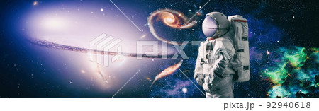 Picture of astronaut spacewalking with glowing stars . Astronaut in outer space. Elements of this image furnished by NASA. 92940618