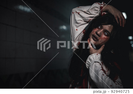 Horror bloodthirsty woman ghost or zombie she is horror scary with breaks her neck Horror bloodthirsty woman ghost or zombie she is horror scary with breaks her neck 92940725