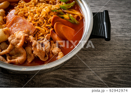 Budae Jjigae or Budaejjigae (Army stew or Army base stew). It is loaded with Kimchi, spam, sausages, ramen noodles and much more 92942974