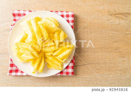 fresh pineapple sliced on plate fresh pineapple sliced on plate 92943816