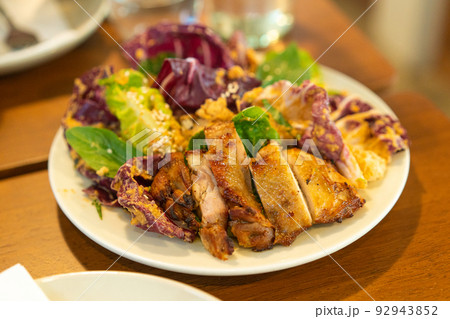 grilled chicken with vegetable salad 92943852