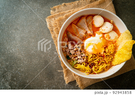 egg noodles with pork and meatball in spicy soup egg noodles with pork and meatball in spicy soup 92943858