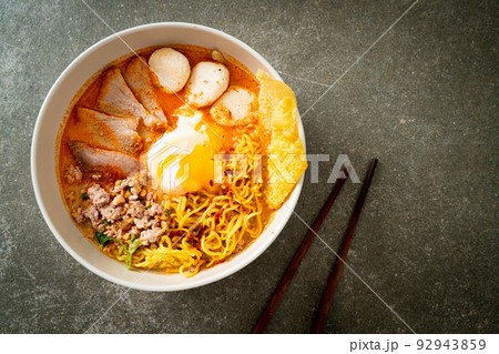 egg noodles with pork and meatball in spicy soup egg noodles with pork and meatball in spicy soup 92943859