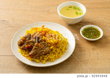 Beef Biryani or Curried rice and beef - Thai-Muslim version of Indian biryani, with fragrant yellow rice and beef Beef Biryani or Curried rice and beef - Thai-Muslim version of Indian biryani, with fragrant yellow rice and beef 92943948