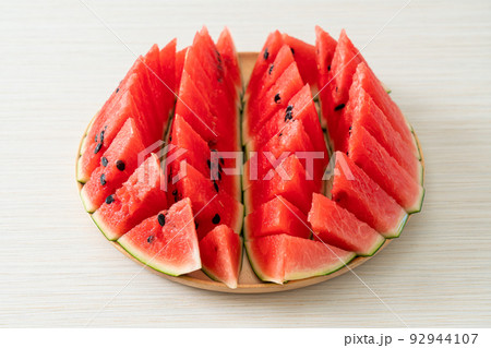fresh watermelon sliced on plate 92944107