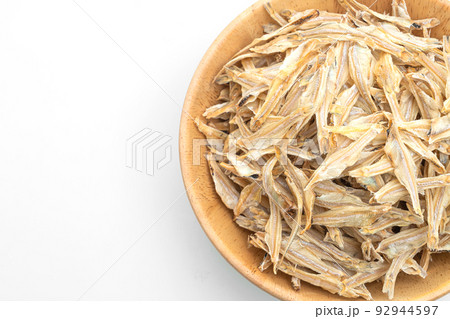 dried small crispy fish on white background 92944597