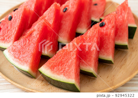 fresh watermelon sliced on plate 92945322