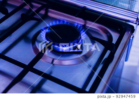 Kitchen gas stove, burner with blue flame Kitchen gas stove, burner with blue flame 92947459