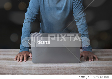 Man working with computer laptop searching browsing internet data. Man working with computer laptop searching browsing internet data. 92948106